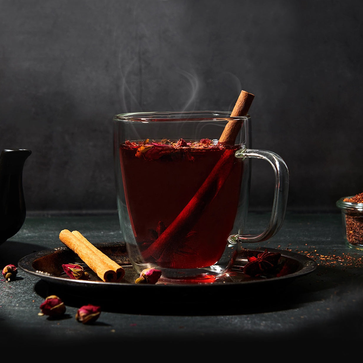 
                  
                    double wall insulated glass teacup with tea and cinnamon
                  
                