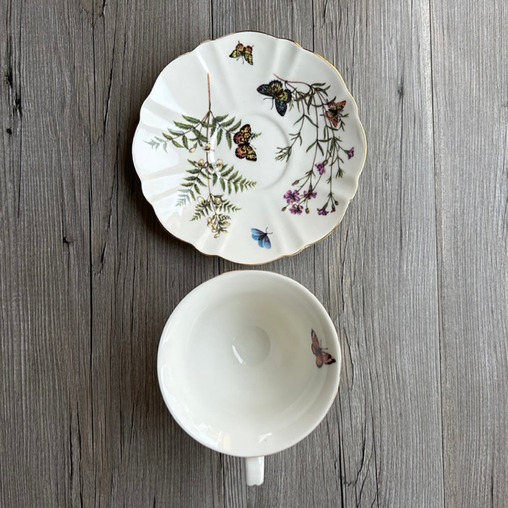 Butterflies and floral tea cup and saucer